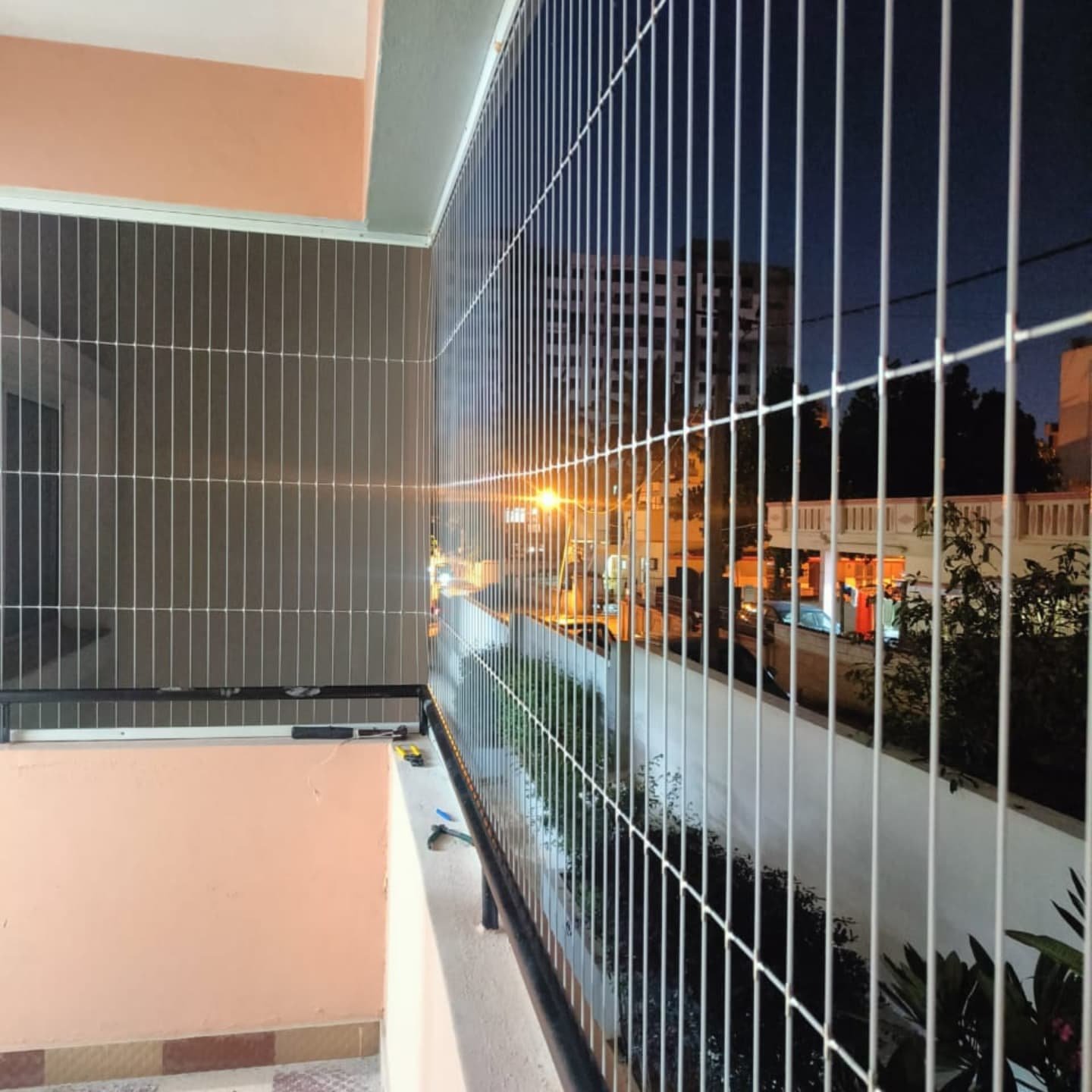 Professional invisible grill installation on balcony